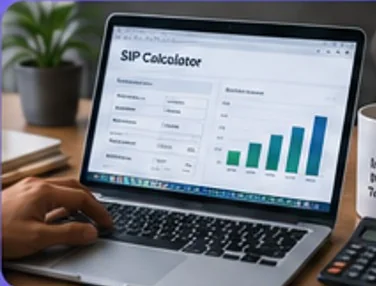 Laptop showing an investment calculator beside a desk calculator